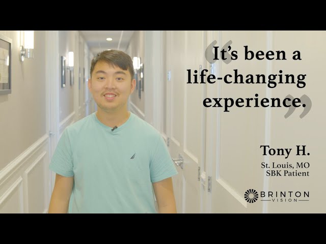 Tony testimonial; Tony, an asian man with a thin mustache shown from the waist up is standing in a hallway at Brinton Vision. On the right of the photo reads the text "It's been a life-changing experience." Beneath that it says "Tony H. St. Louis, MO SBK Patient". Beneath that is the Brinton Vision logo